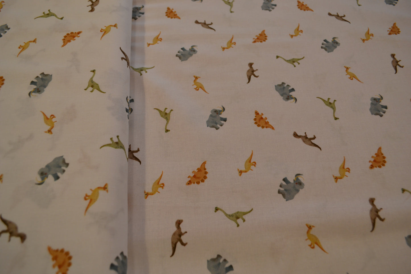 Baumwolle "Dinos" blau grün braun weiß *Breite 142 cm*