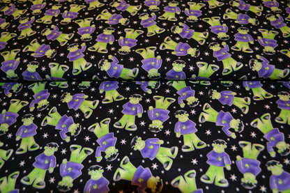 Patchwork Baumwolle "Glow in the dark" lila grün schwarz *Breite 110 cm*