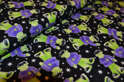 Patchwork Baumwolle "Glow in the dark" lila grün schwarz *Breite 110 cm*
