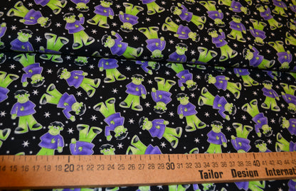 Patchwork Baumwolle "Glow in the dark" lila grün schwarz *Breite 110 cm*